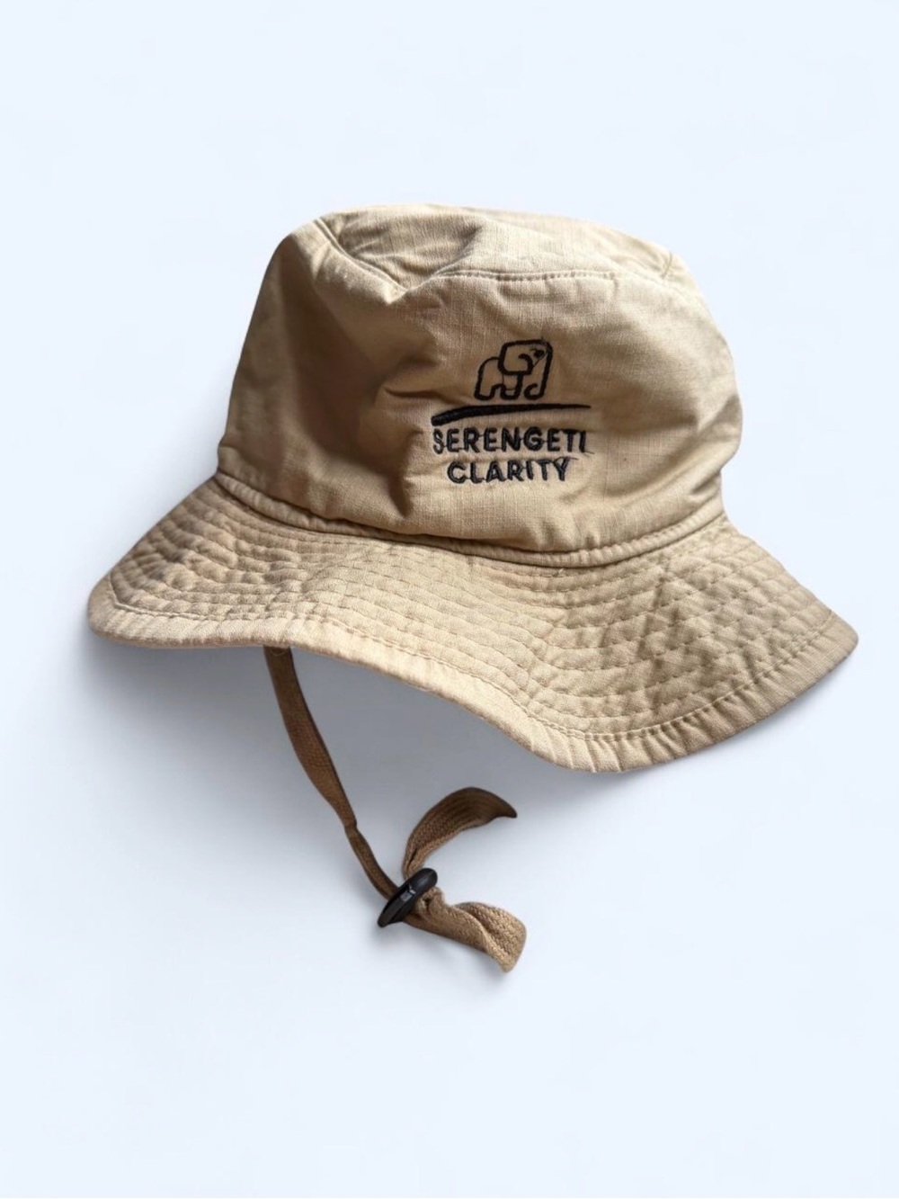 Tan bucket hat with adjustable chin strap